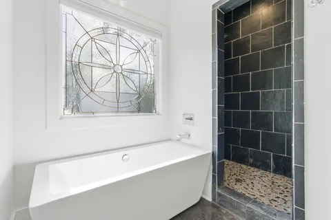 a front view of a house with a yard table and chairs