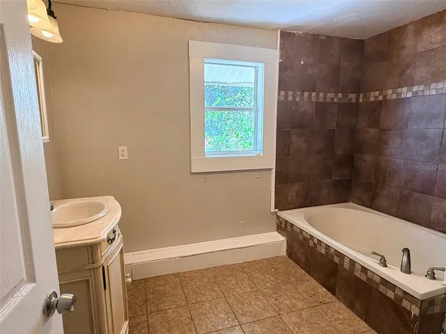 a bathroom with a sink a bathtub and a toilet