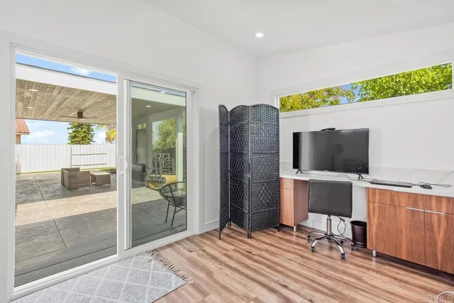 a room with furniture and a flat screen tv