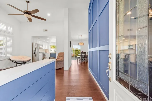 a view of a kitchen center island cabinets and wooden floor
