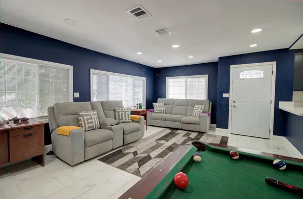 a living room with furniture and a window