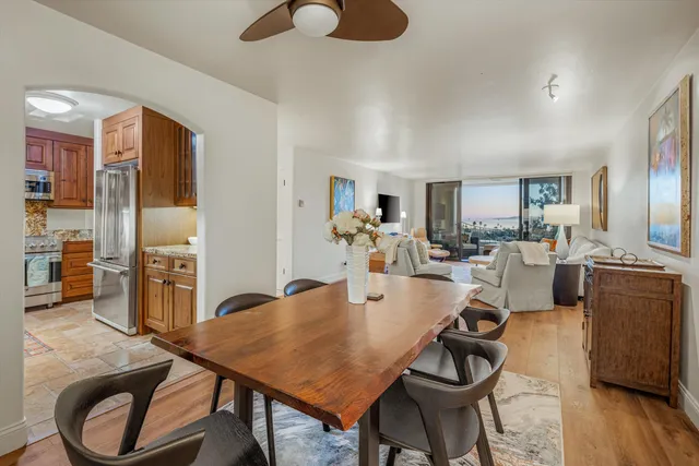 a en suite bathroom with a granite countertop sink and a mirror