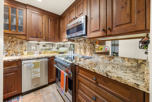 a balcony with furniture and a potted plant