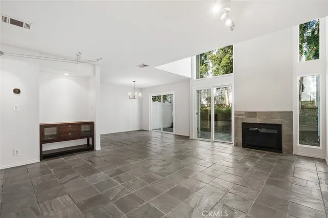 a view of livingroom with furniture and an empty room
