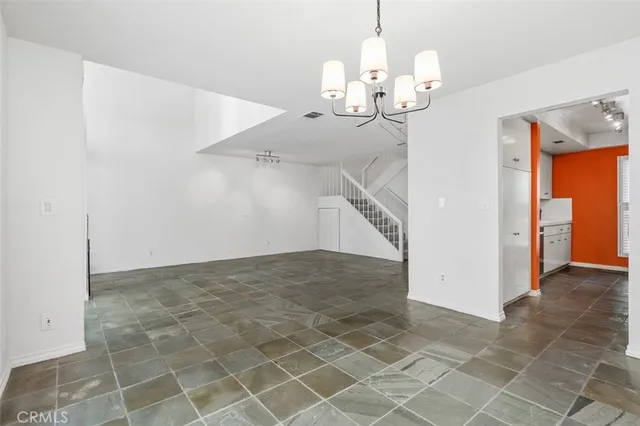 a kitchen with stainless steel appliances granite countertop a stove and a sink