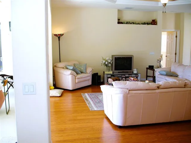 a living room with a couch and a flat screen tv