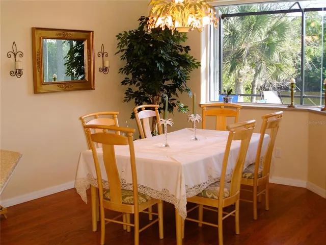 a dining room with furniture and window