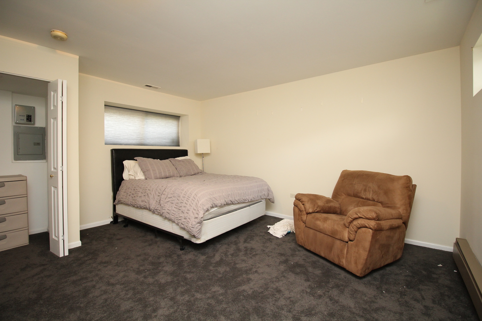 Undisclosed Address Chicago, IL 60657 - Photo 12 of 23 a bedroom with a bed and a couch