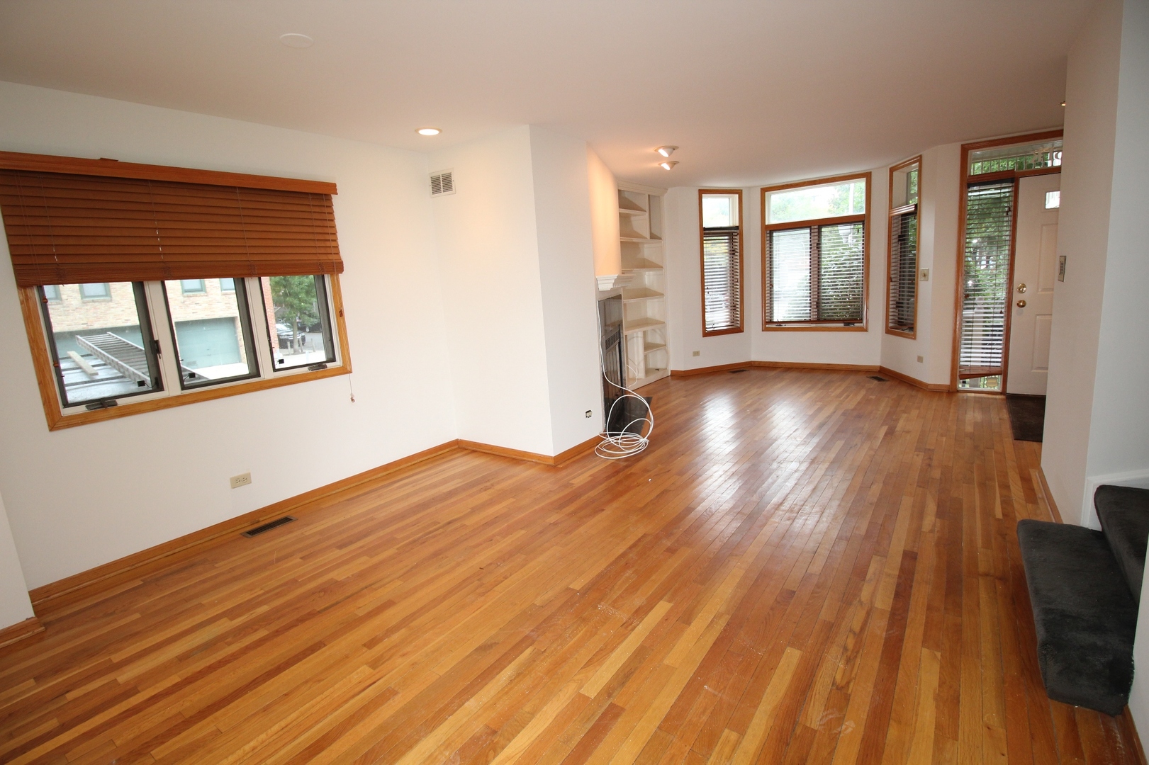 Undisclosed Address Chicago, IL 60657 - Photo 17 of 23 a view of a room with wooden floors and stairs