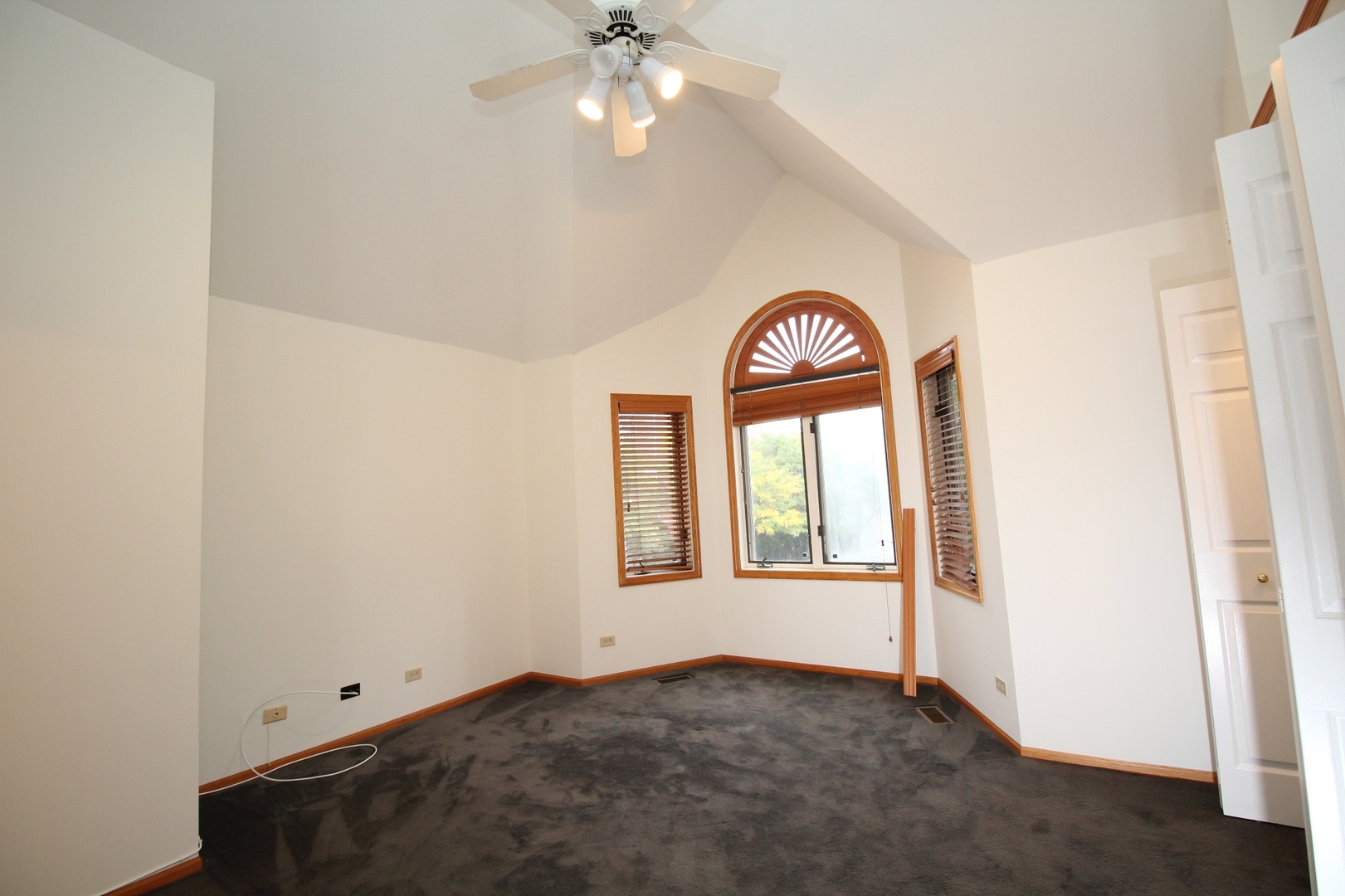 Undisclosed Address Chicago, IL 60657 - Photo 19 of 23 an empty room with a window and a ceiling fan
