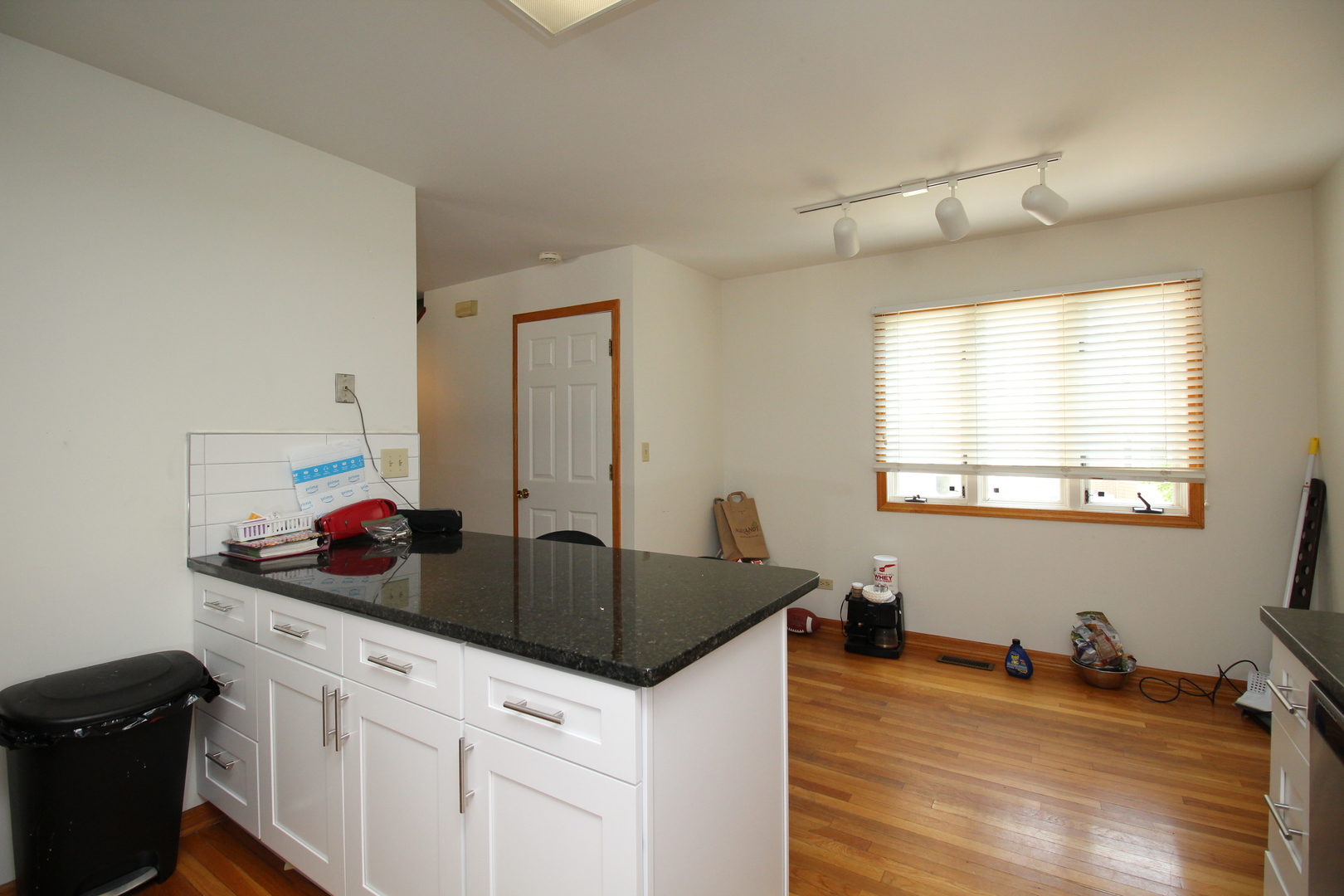 Undisclosed Address Chicago, IL 60657 - Photo 8 of 23 a kitchen with stainless steel appliances granite countertop a sink and a stove