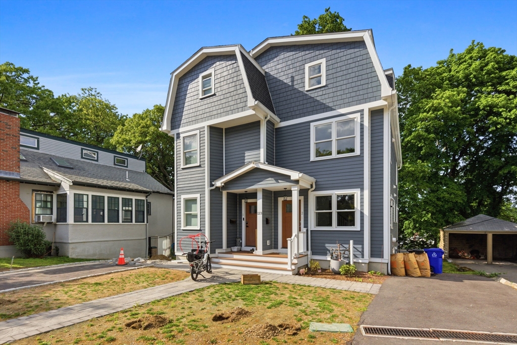 123 Nottinghill Road, Unit 2 Boston, MA 02135 - Photo 1 of 30 a front view of a house with a yard