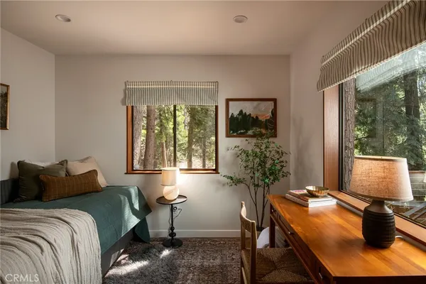 a living room with furniture flat screen tv and a fireplace