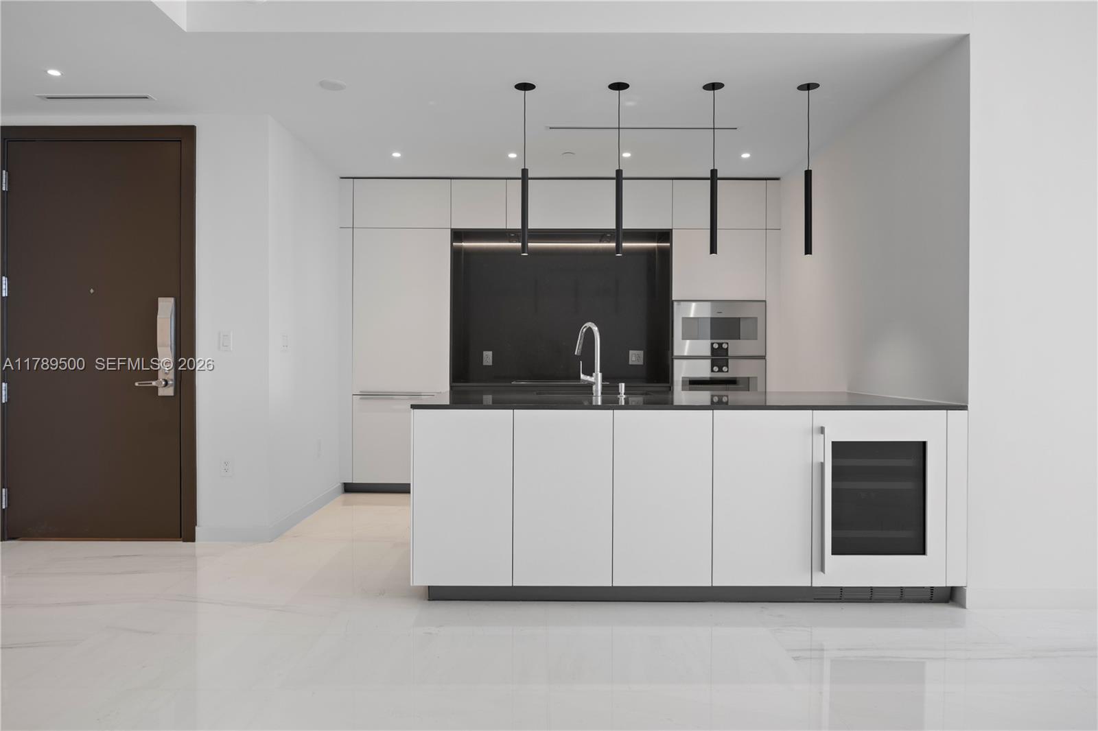 300 Biscayne Blvd Way, Unit 1102 Miami, FL 33131 - Photo 12 of 37 a view of a utility room with washer and dryer