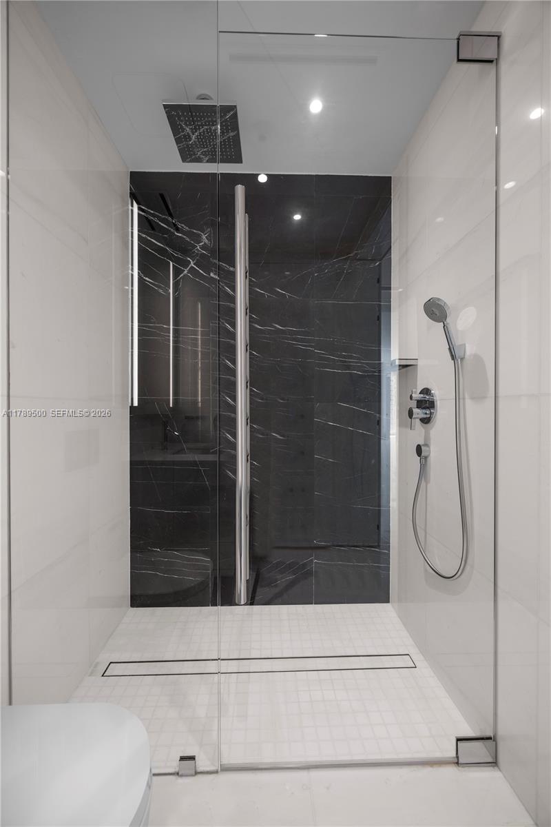 300 Biscayne Blvd Way, Unit 1102 Miami, FL 33131 - Photo 20 of 37 a bathroom with a shower