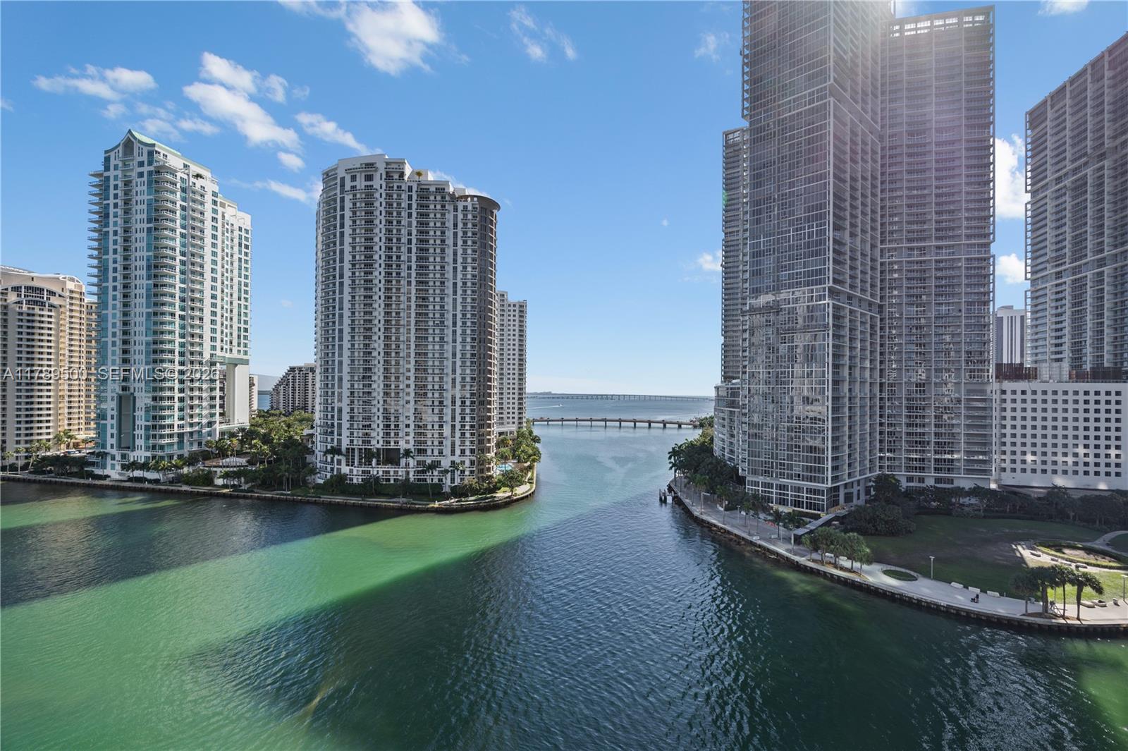 300 Biscayne Blvd Way, Unit 1102 Miami, FL 33131 - Photo 2 of 37 a view of a lake with tall buildings