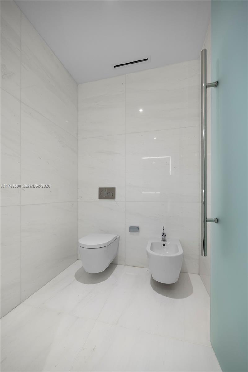 300 Biscayne Blvd Way, Unit 1102 Miami, FL 33131 - Photo 30 of 37 a bathroom with a toilet and a sink