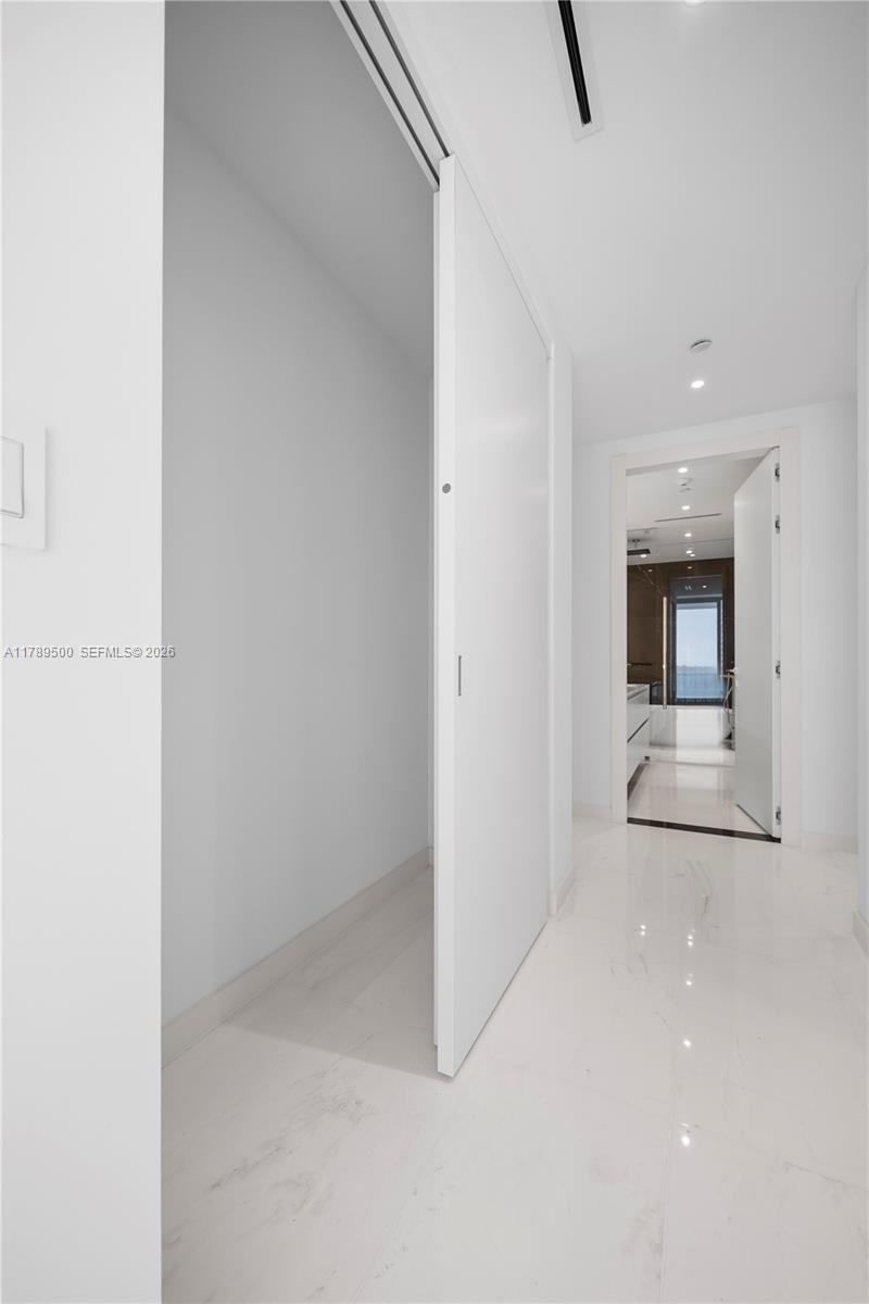 300 Biscayne Blvd Way, Unit 1102 Miami, FL 33131 - Photo 31 of 37 a view of a hallway with a bathroom
