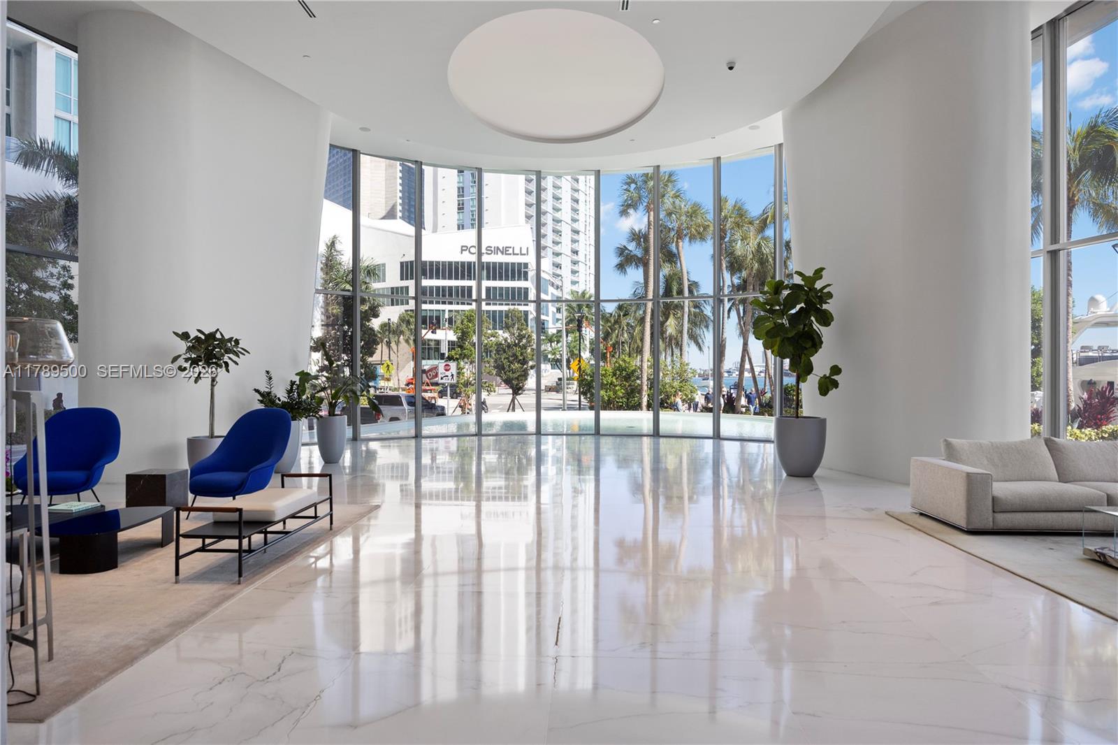 300 Biscayne Blvd Way, Unit 1102 Miami, FL 33131 - Photo 7 of 37 a living room filled with furniture and a potted plant