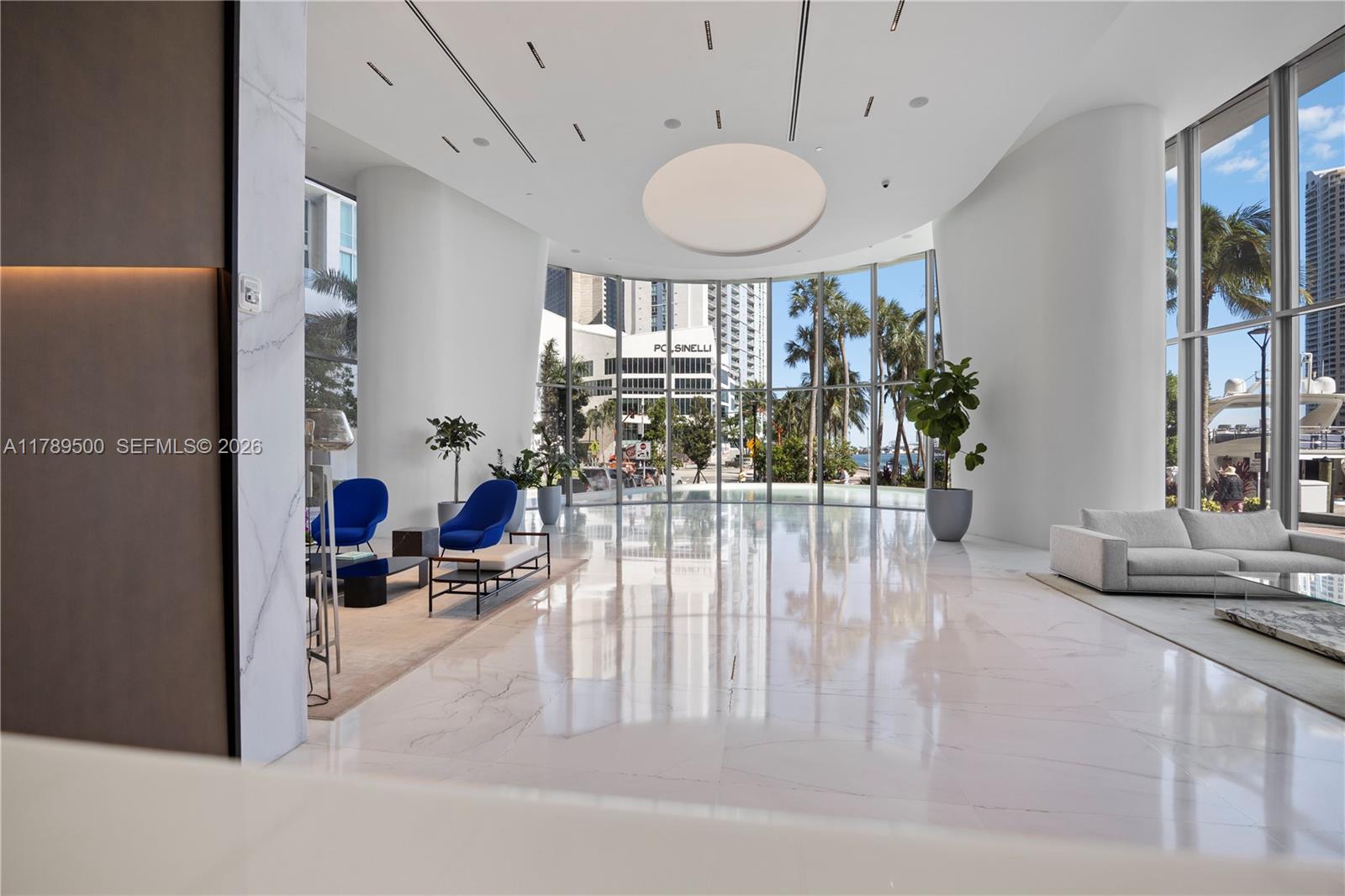 300 Biscayne Blvd Way, Unit 1102 Miami, FL 33131 - Photo 8 of 37 a lobby with furniture and a chandelier