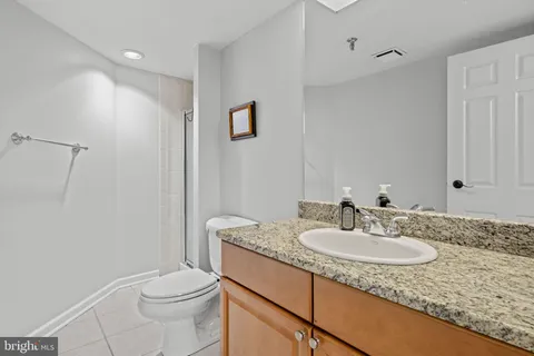 a bathroom with a glass door shower