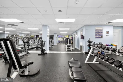 a front view of multi story residential apartment building with yard