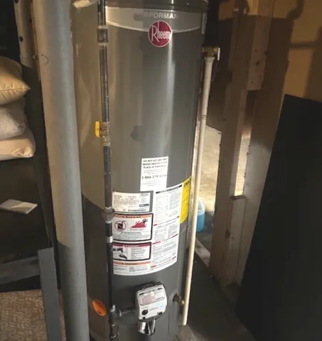 a view of a yard with wooden fence