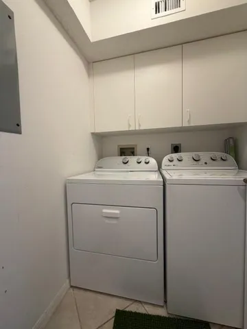 a balcony with table and chairs