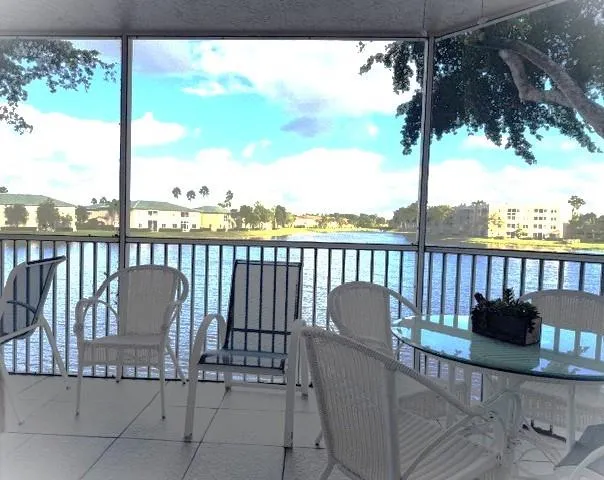 a view of a chair and table in patio