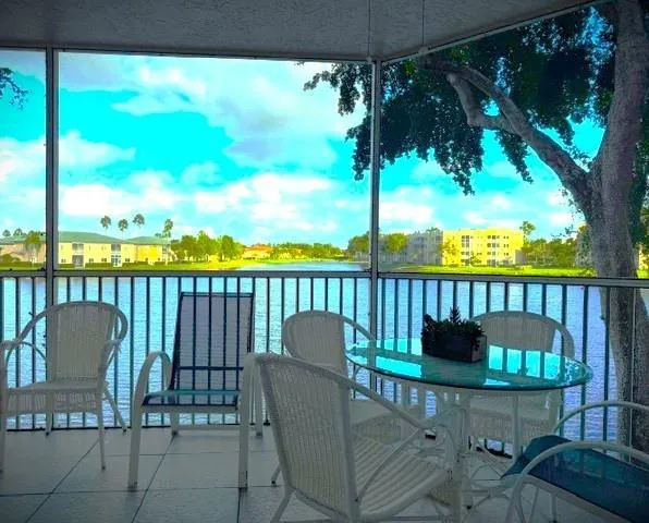 a view of a chair and table in the balcony