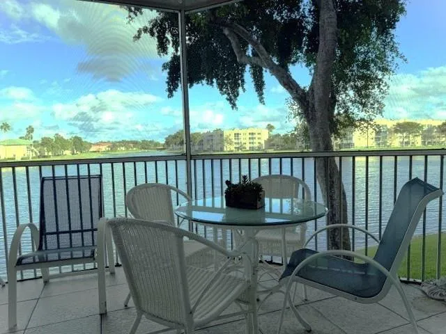 a view of a backyard with swimming pool