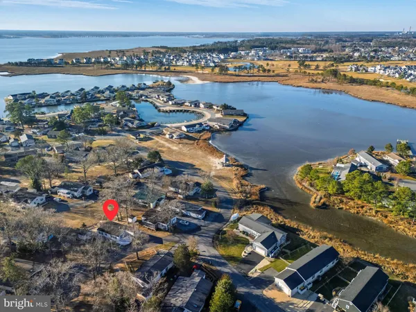 an aerial view of a residential building with an ocean view