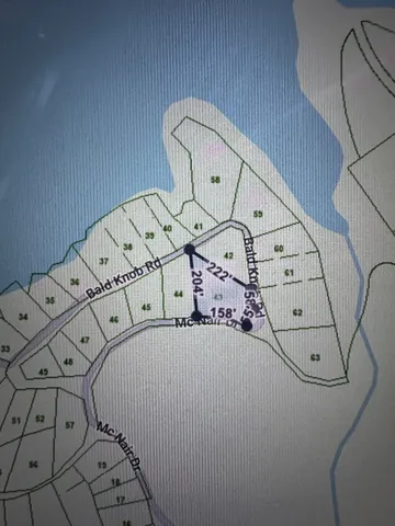 a view of a wooden floor with white walls