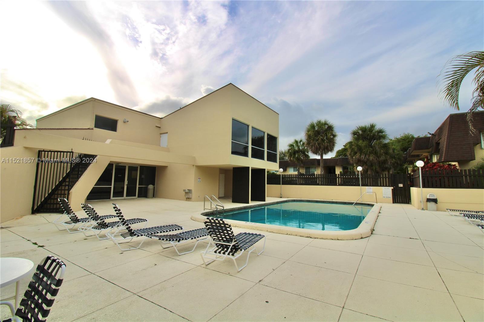 9015 Southwest 138th Street, Unit 162 Miami, FL 33176 - Photo 13 of 16 a view of a house with swimming pool and sitting area