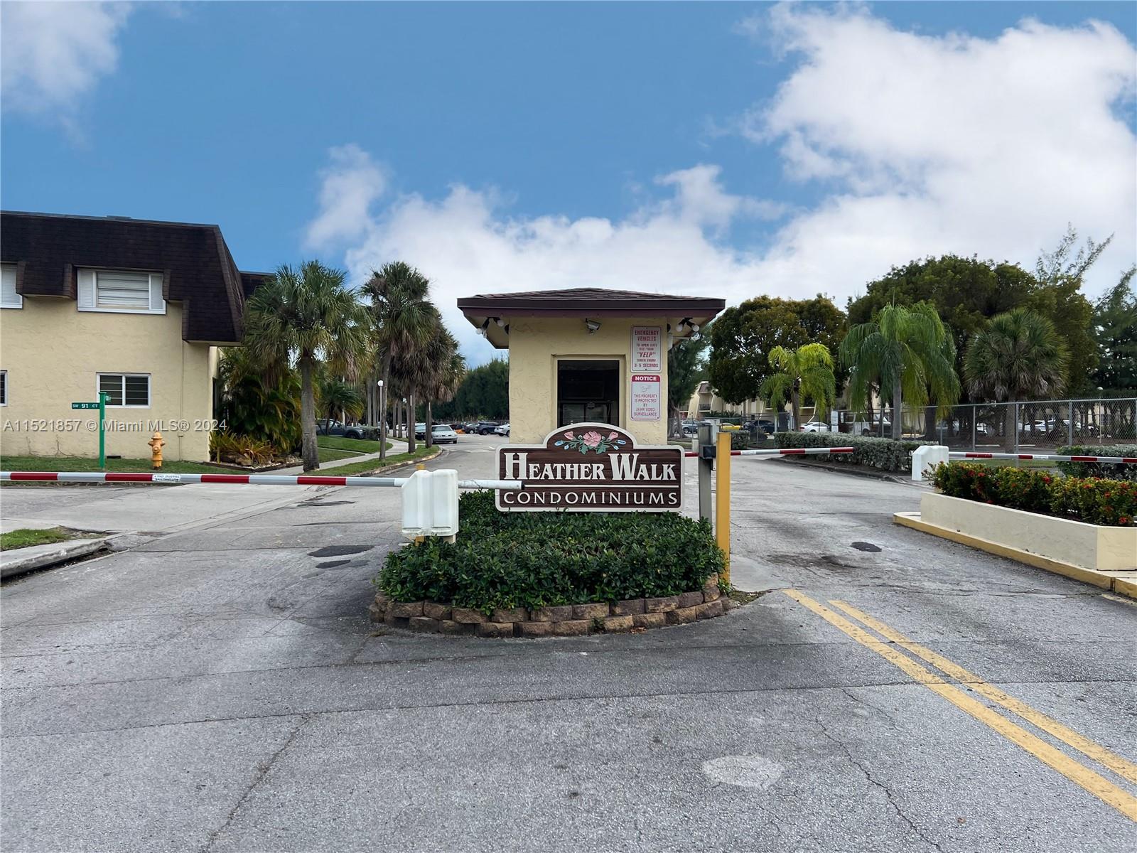9015 Southwest 138th Street, Unit 162 Miami, FL 33176 - Photo 2 of 16 a front view of a house with a yard