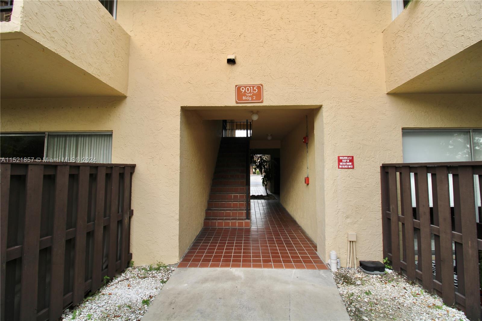 9015 Southwest 138th Street, Unit 162 Miami, FL 33176 - Photo 3 of 16 a view of a hallway view with wooden floor and staircase