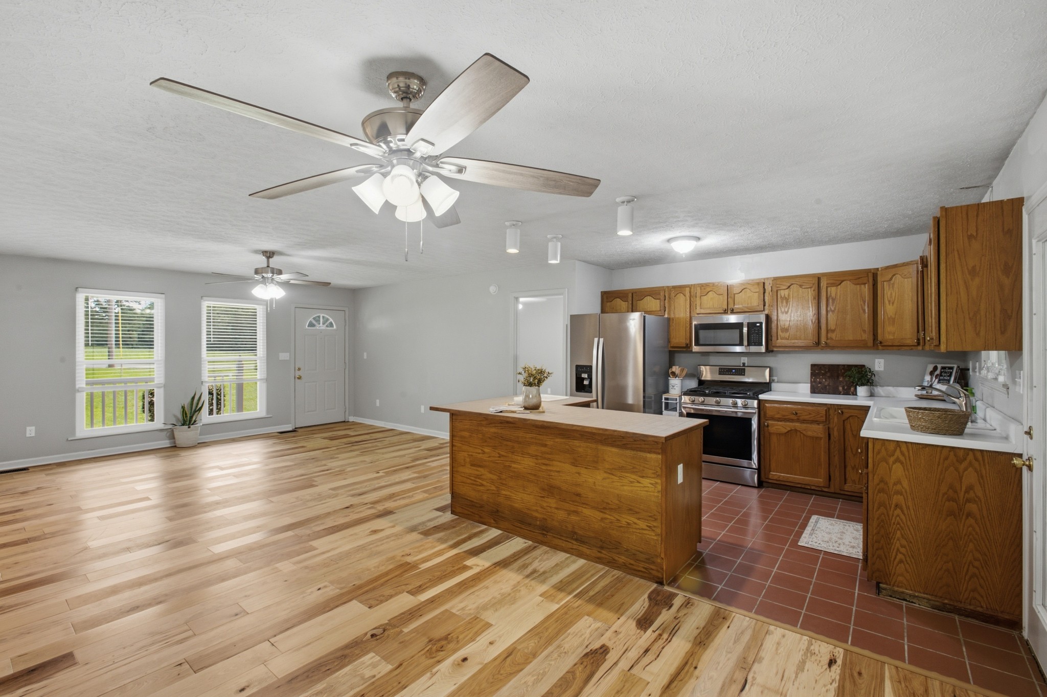 1466 West Grab Creek Road Dickson, TN 37055 - Photo 12 of 30 a view of kitchen with granite countertop appliances wooden floor and a window