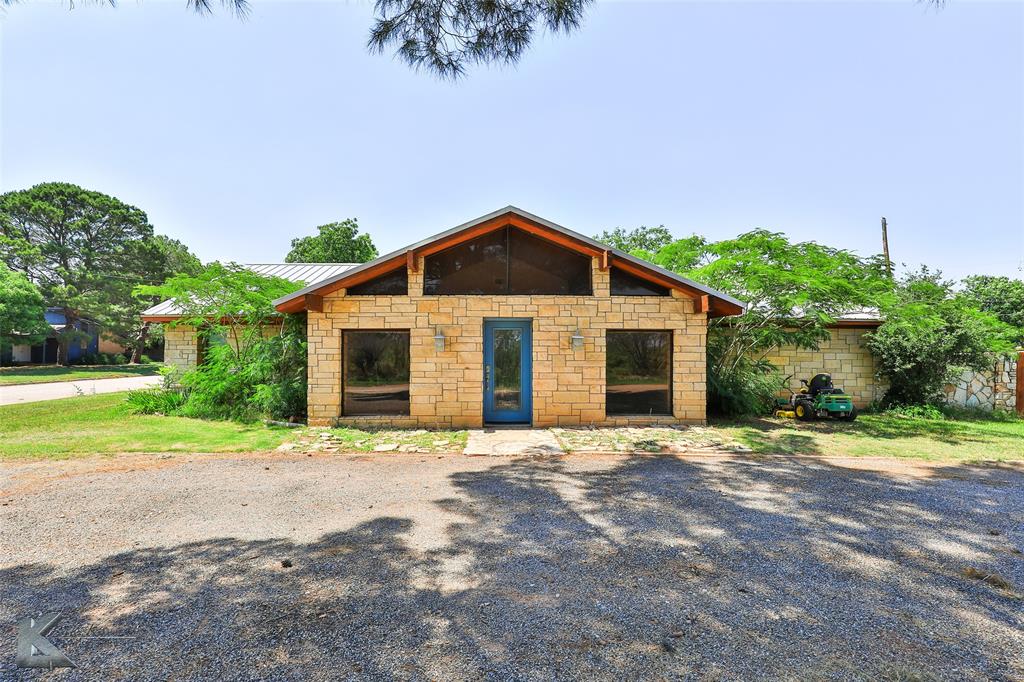 920 Southwest 3rd Street Hamlin, TX 79520 - Photo 1 of 1 View of front of property with stone siding, a standing seam roof, and metal roof