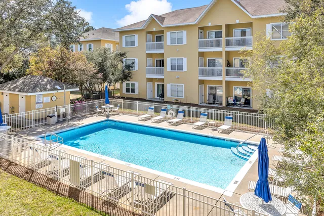 a front view of a house with swimming pool