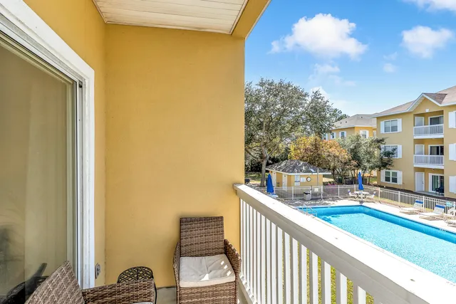 a view of balcony with furniture
