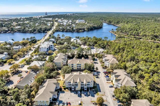 an aerial view of a houses with a city