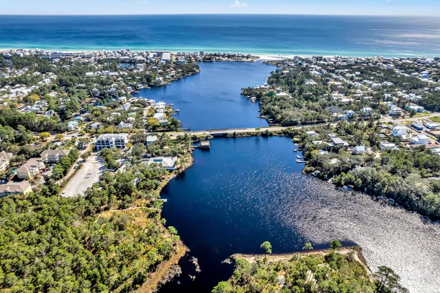 a view of a patio with table and chairs under an umbrella