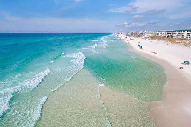 a view of a balcony dining table and chairs