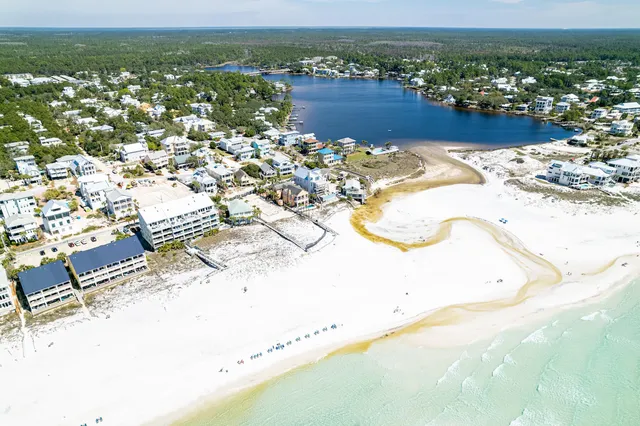 a view of large pool with table and chairs