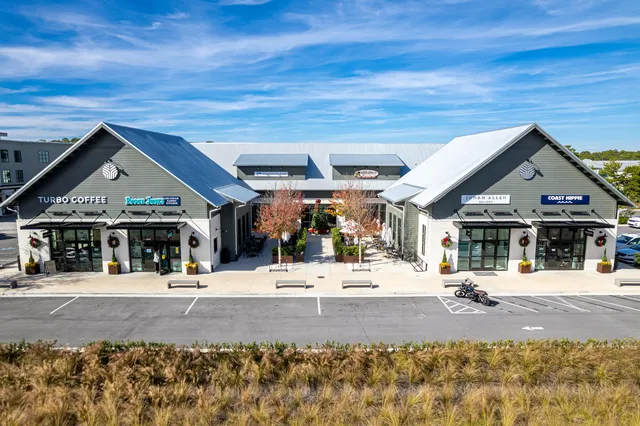 a view of a patio with a table and chairs