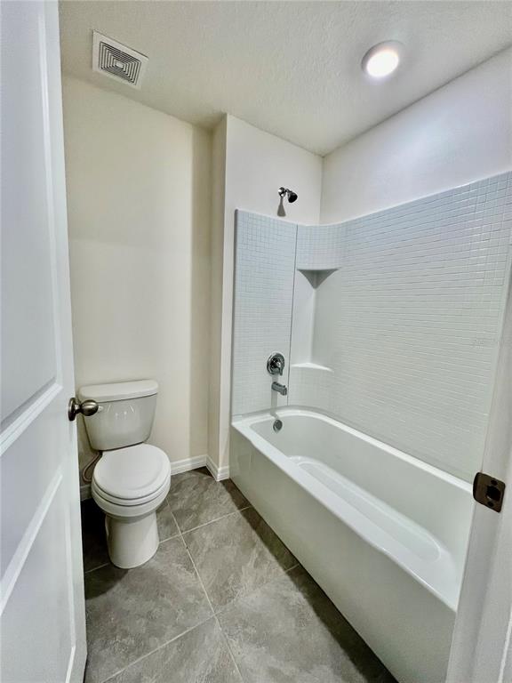 8884 Southwest 49th Circle Ocala, FL 34476 - Photo 33 of 39 a bathroom with a toilet sink and bathtub