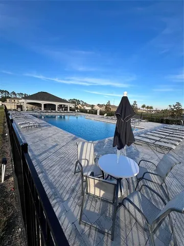 a view of a chairs and table in patio