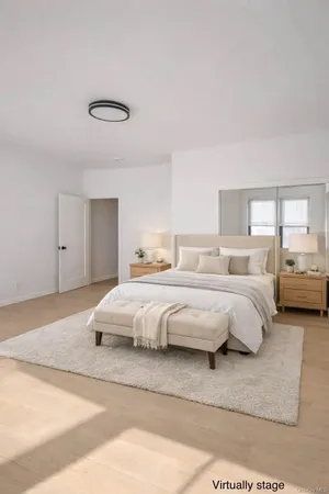 a spacious bedroom with a bed and closet