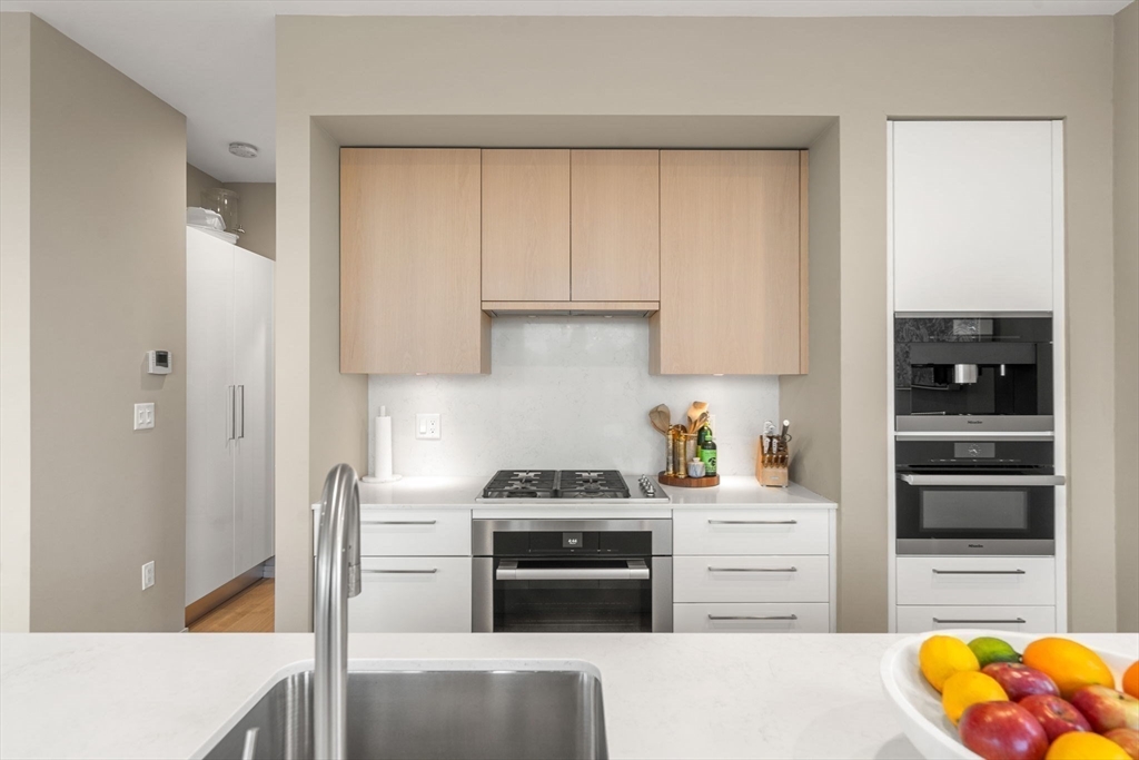 7 East Springfield Street, Unit PH6 Boston, MA 02118 - Photo 19 of 42 a kitchen with stainless steel appliances granite countertop a refrigerator and a stove top oven