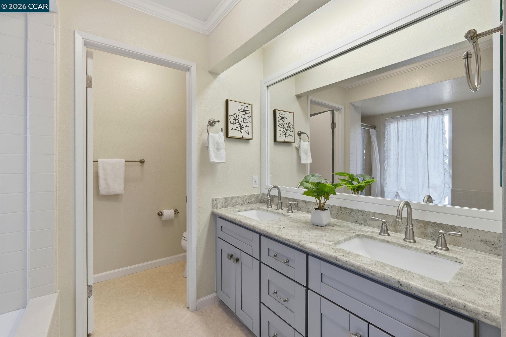 1707 Geary Road Walnut Creek, CA 94597 - Photo 30 of 43 a bathroom with a granite countertop sink mirror and double